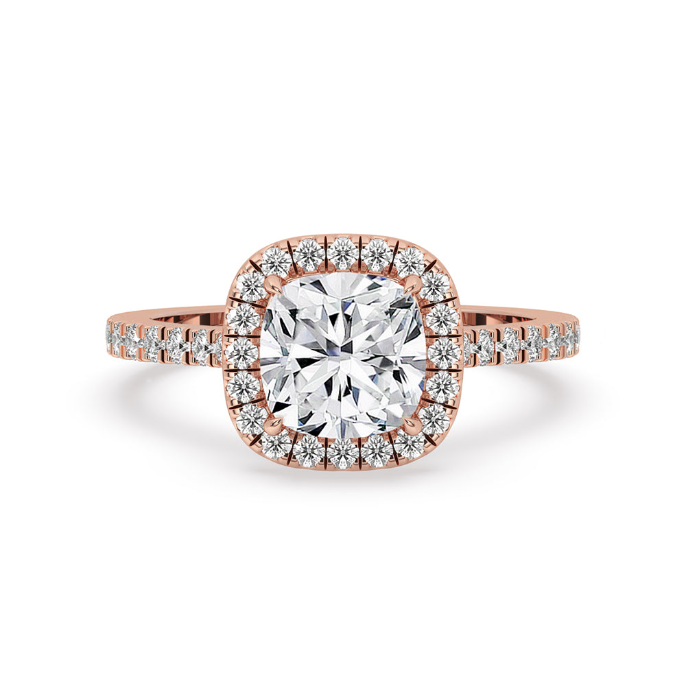 Cushion cut engagement ring with a stunning cushion halo design and pave diamond band.
