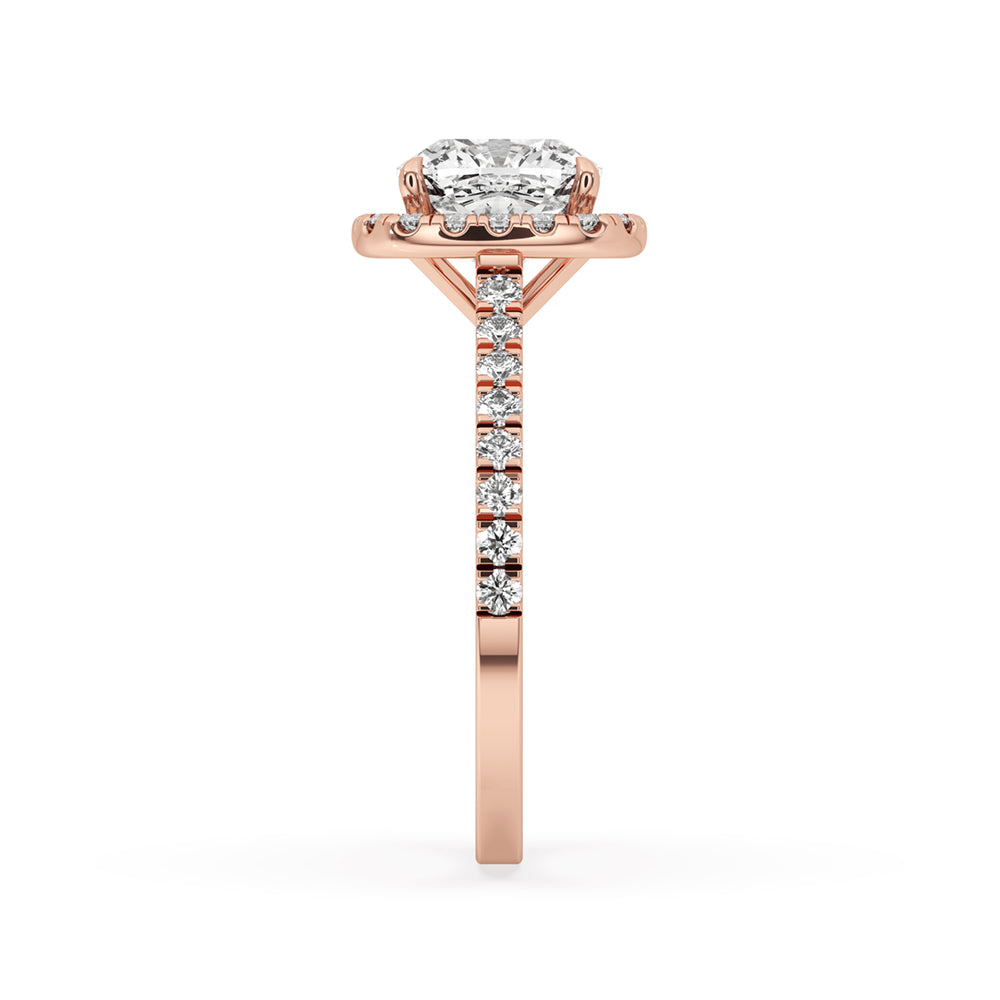 Cushion cut ring featuring cushion diamond and cathedral setting engagement ring style.