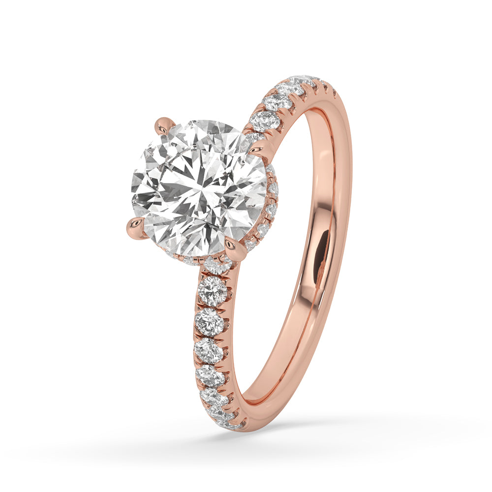 Handmade ring featuring a 2 ct round diamond engagement ring in a claw prong ring setting, enhanced by a beautiful double halo.
