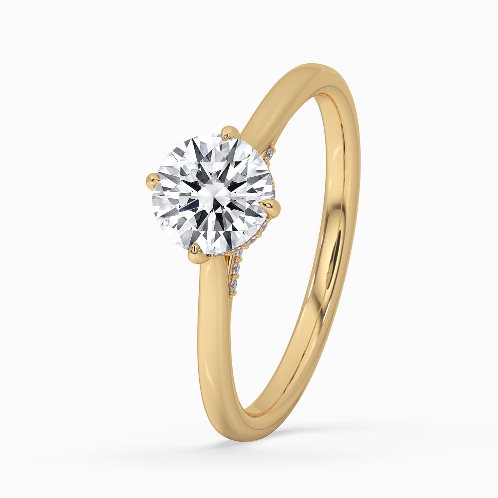 Hidden halo ring featuring a unique hidden halo setting, crafted to enhance the brilliance of the round diamond centerpiece.
