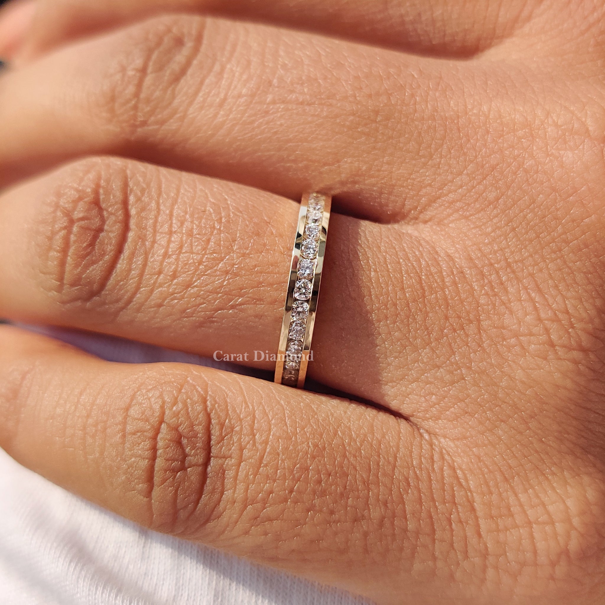 Yellow gold band with a channel set diamond band for added brilliance.
