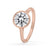 Round diamond engagement ring crafted with a rose gold cathedral setting for timeless elegance.
