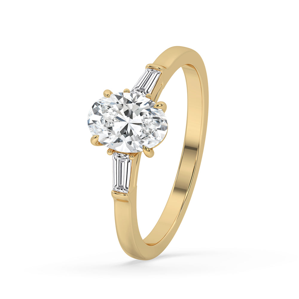 Oval diamond ring with tapered baguette diamonds, crafted to add sophistication to any special occasion.
