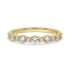 Half eternity band with sparkling diamonds set in a sleek design.
