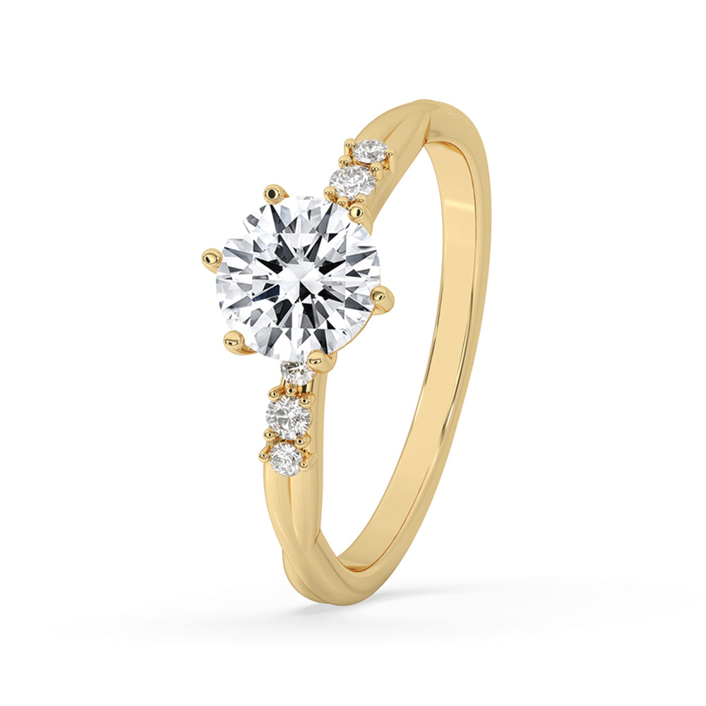 Gold round diamond ring with a side stone engagement ring style, perfect for special occasions and everyday elegance.