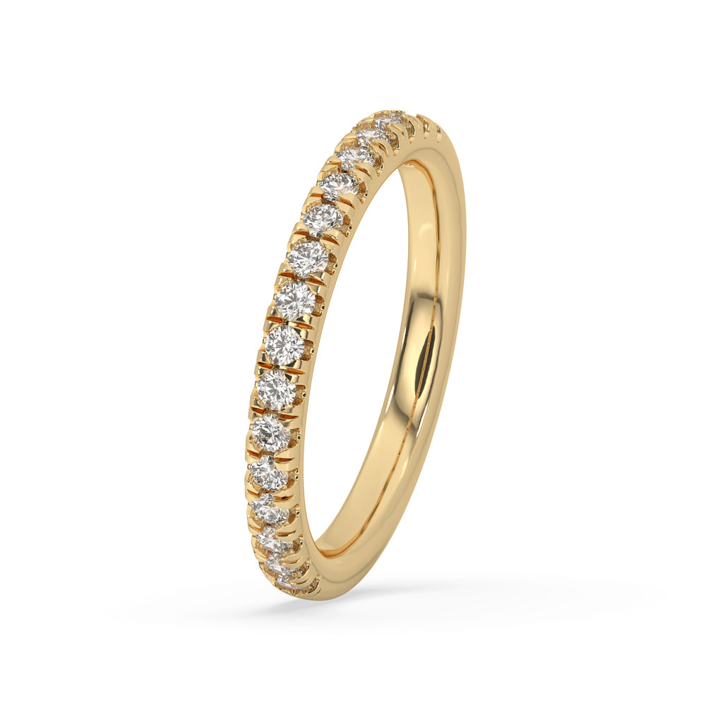 A round diamond wedding band featuring a delicate arrangement of stones.
