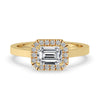 Two carat emerald cut diamond ring with cathedral setting ring in yellow gold
