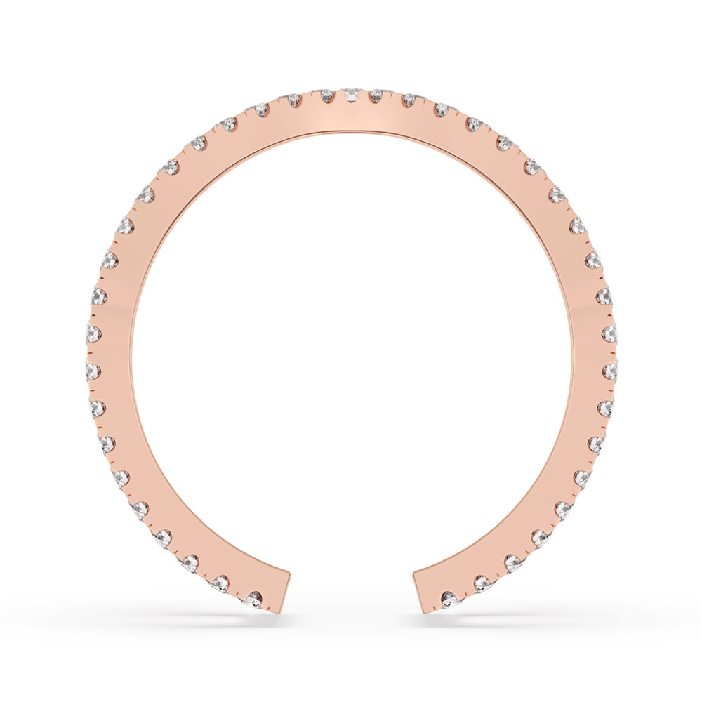 Criss cross wedding band showcasing a handmade band with round cut diamonds for timeless elegance.
