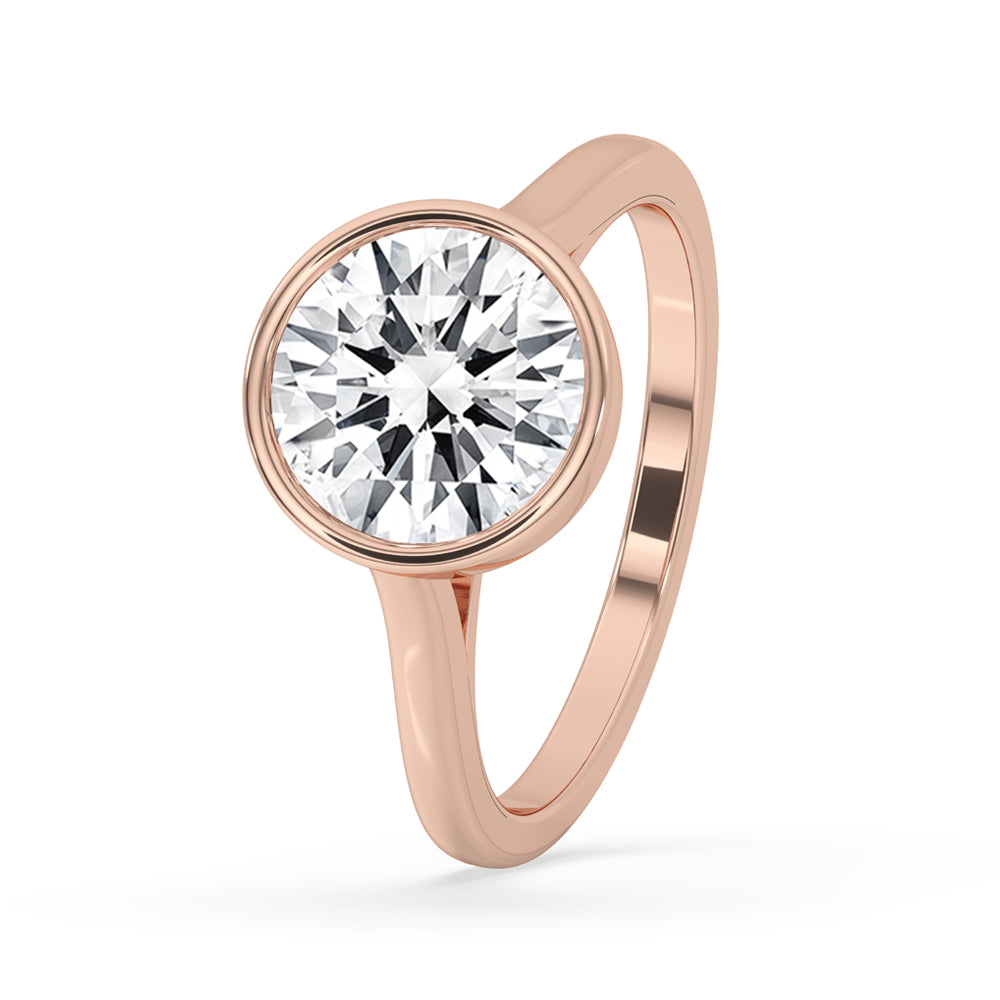 Bezel set round diamond ring showcasing timeless beauty.