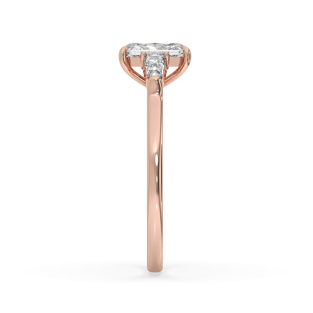 Baguette cut diamond ring with tapered baguettes and radiant diamond cut setting, ideal for classic style lovers.