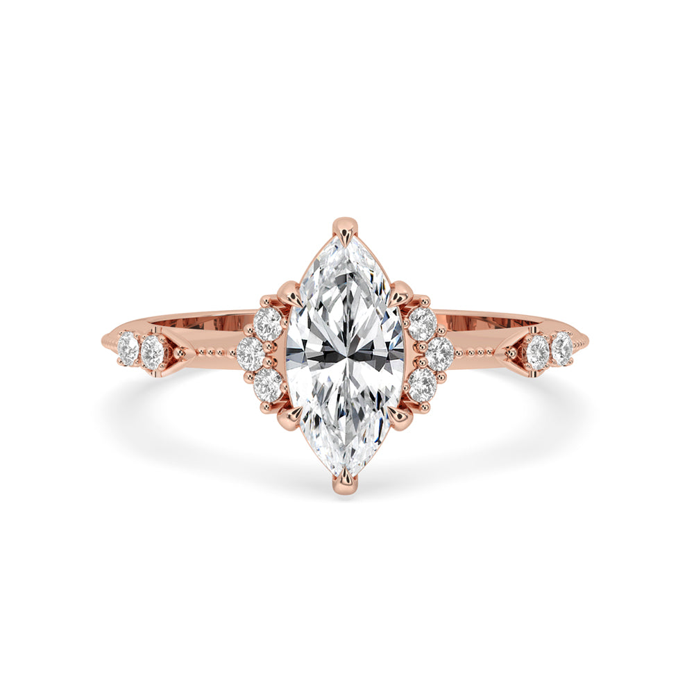 Vintage marquise engagement ring with claw prongs and unique sidestone setting, featuring an IGI certified Lab Grown Diamond.