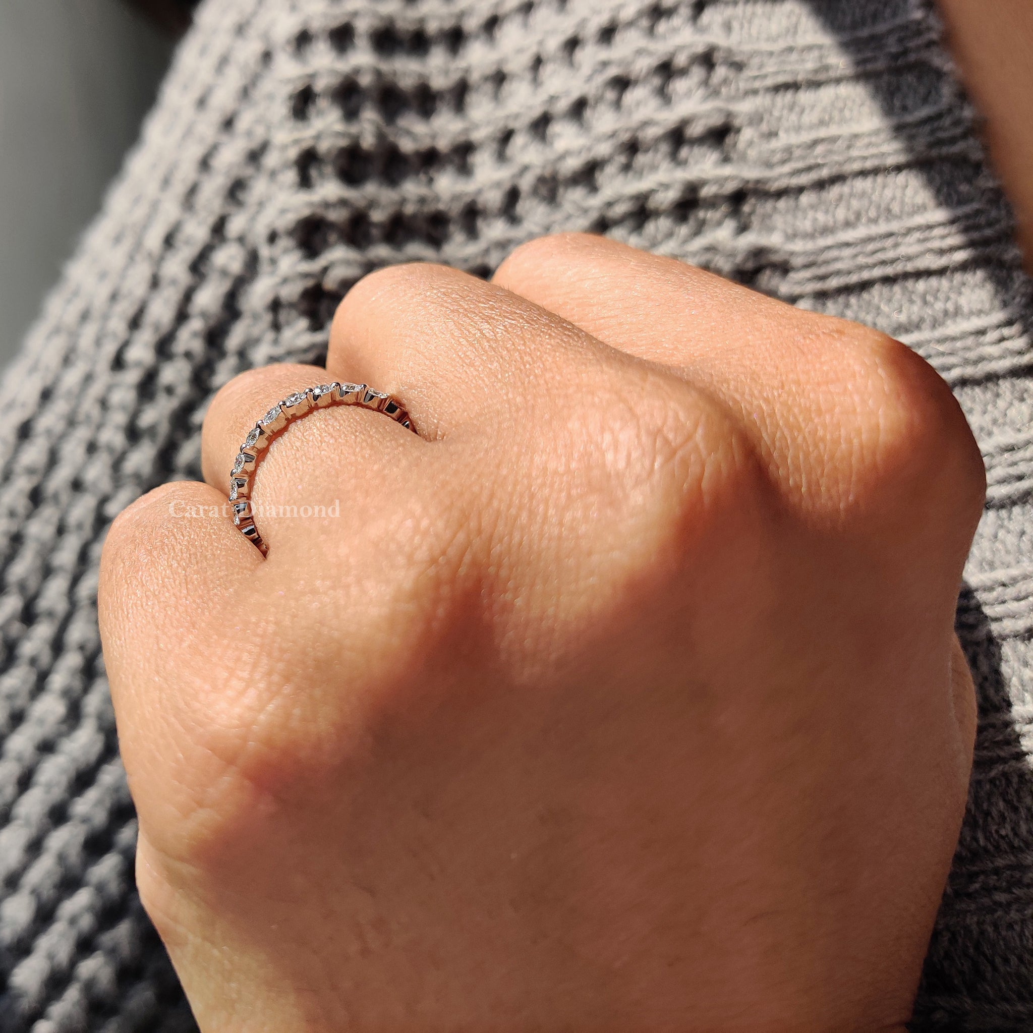 Wedding band stack featuring a shared prong set of lab grown diamond, adding brilliance to any bridal set.