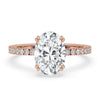 Oval hidden halo engagement ring featuring a dazzling oval diamond with pave setting for timeless elegance and sparkle.
