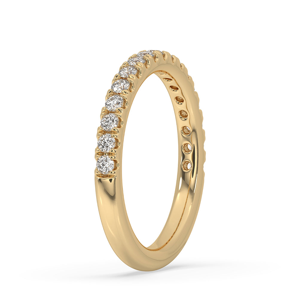 Yellow gold wedding band featuring a round diamond wedding band for added elegance.
