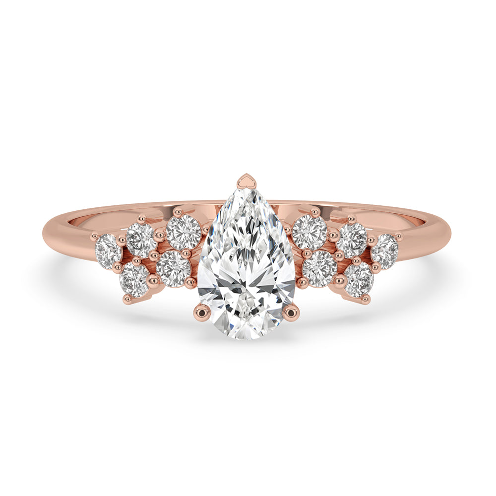 Gold pear shaped engagement ring with a prong setting ring and handmade jewelry design for timeless elegance.