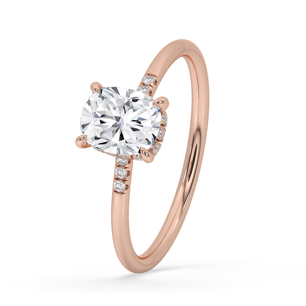 Elongated cushion cut diamond ring featuring a claw prong setting with elegant handmade jewelry craftsmanship.