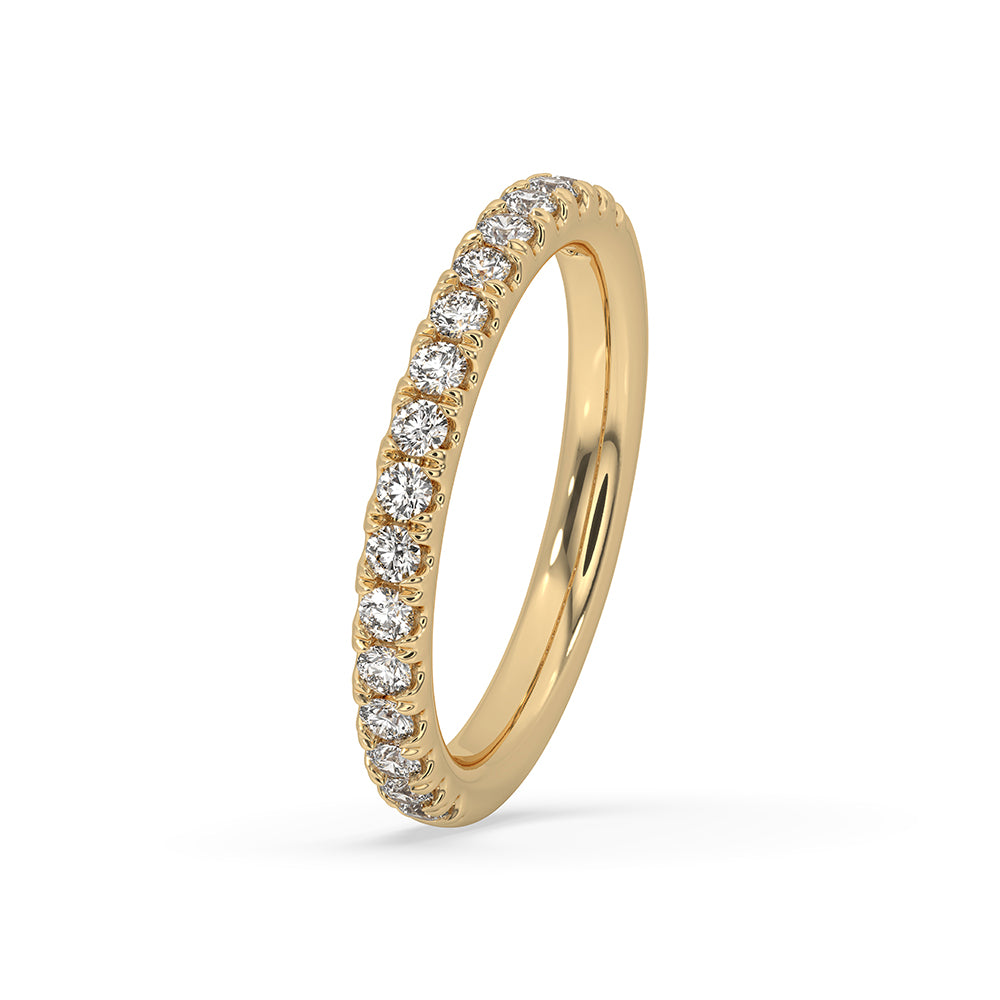 Shared prong band in yellow gold wedding band for secure diamond settings.
