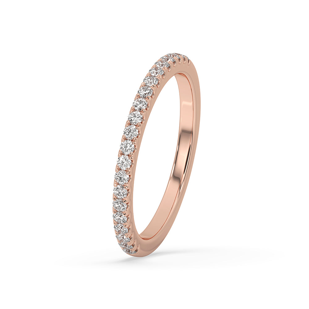 Round diamond wedding band featuring a sparkling half eternity wedding band.
