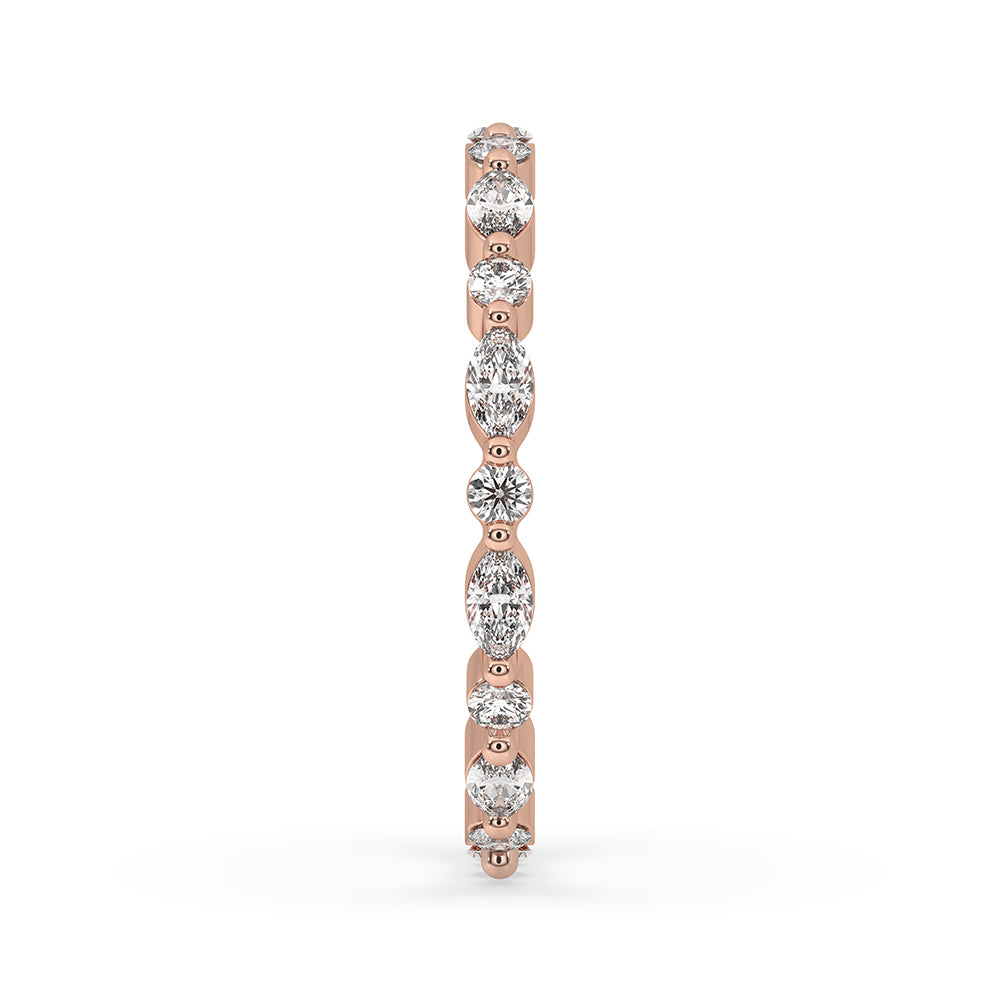 Round eternity band with marquise diamond wedding band for added elegance.
