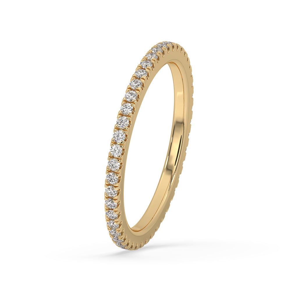 Yellow gold wedding band with round diamonds and a full eternity band design.
