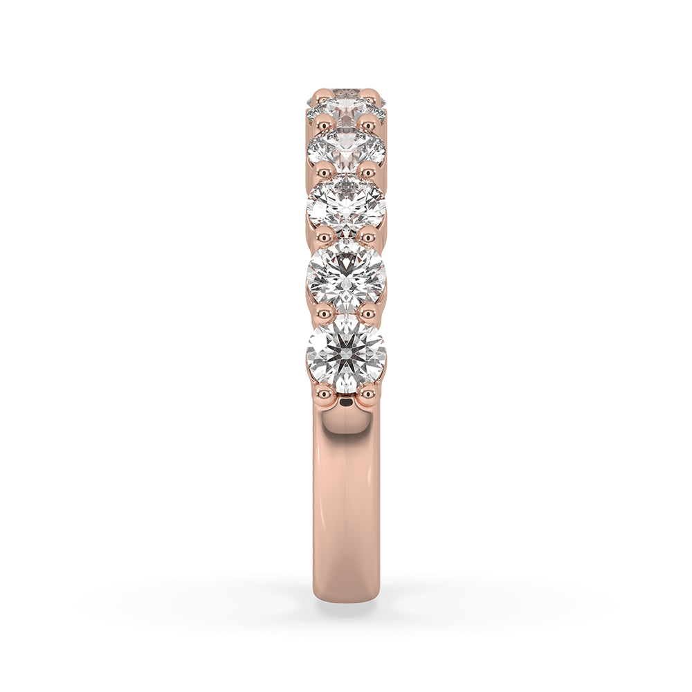 Rose gold wedding band featuring a beautiful round diamond eternity band.
