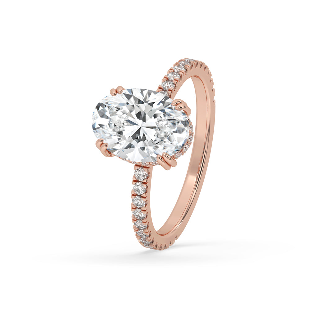 Hidden halo oval engagement ring showcasing an oval cut diamond with a double prong engagement ring design.
