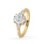 Oval cut diamond with pear side stones in yellow gold.
