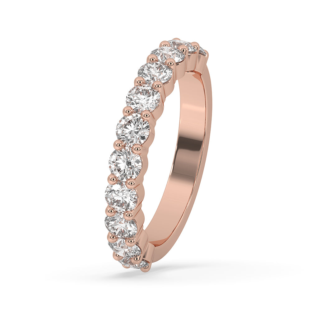 Shared prong band with round diamonds in a round diamond wedding band.
