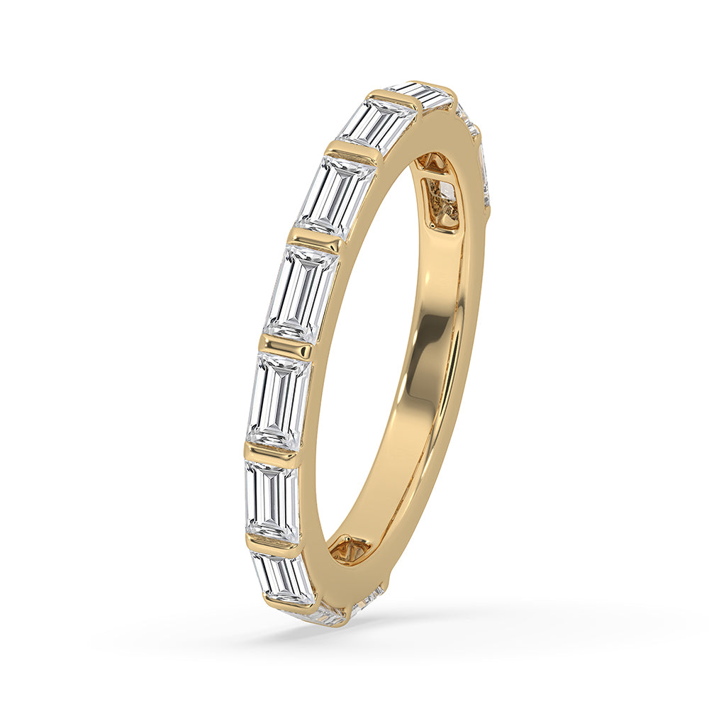 Yellow gold wedding band featuring a baguette diamond band design.
