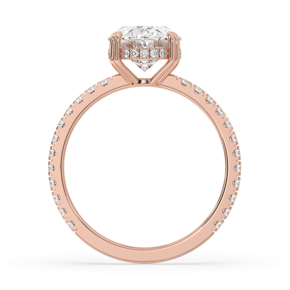 Oval ring with hidden halo and pave set accents, offering a modern and sophisticated touch to your jewelry collection.
