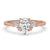 Pear shaped diamond engagement ring with prong setting and tapered baguette side stones
