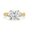 East west oval engagement ring with a modern design in claw prongs.