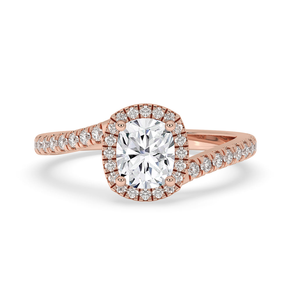 Cushion engagement ring with pave diamond band in elegant prong setting.
