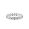 Gold eternity band featuring a stunning round diamond wedding band.
