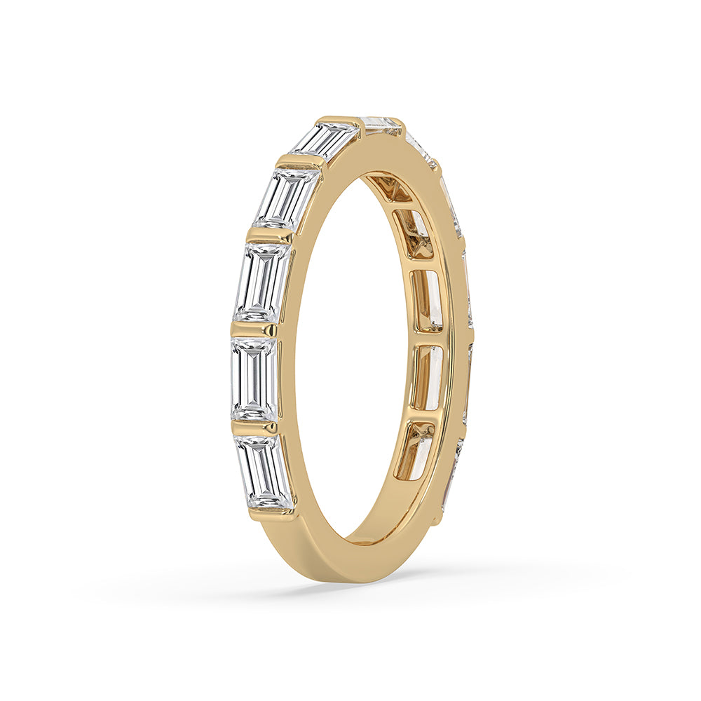 Baguette diamond wedding band in yellow gold for a timeless look.
